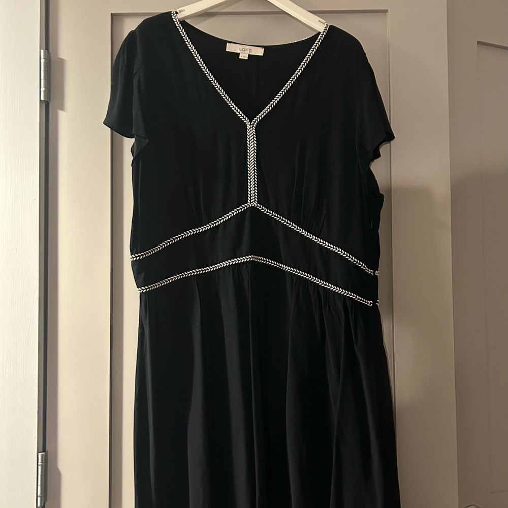 Black Dress with White Trim. Side zipper. Hangs 23 inches from waist.